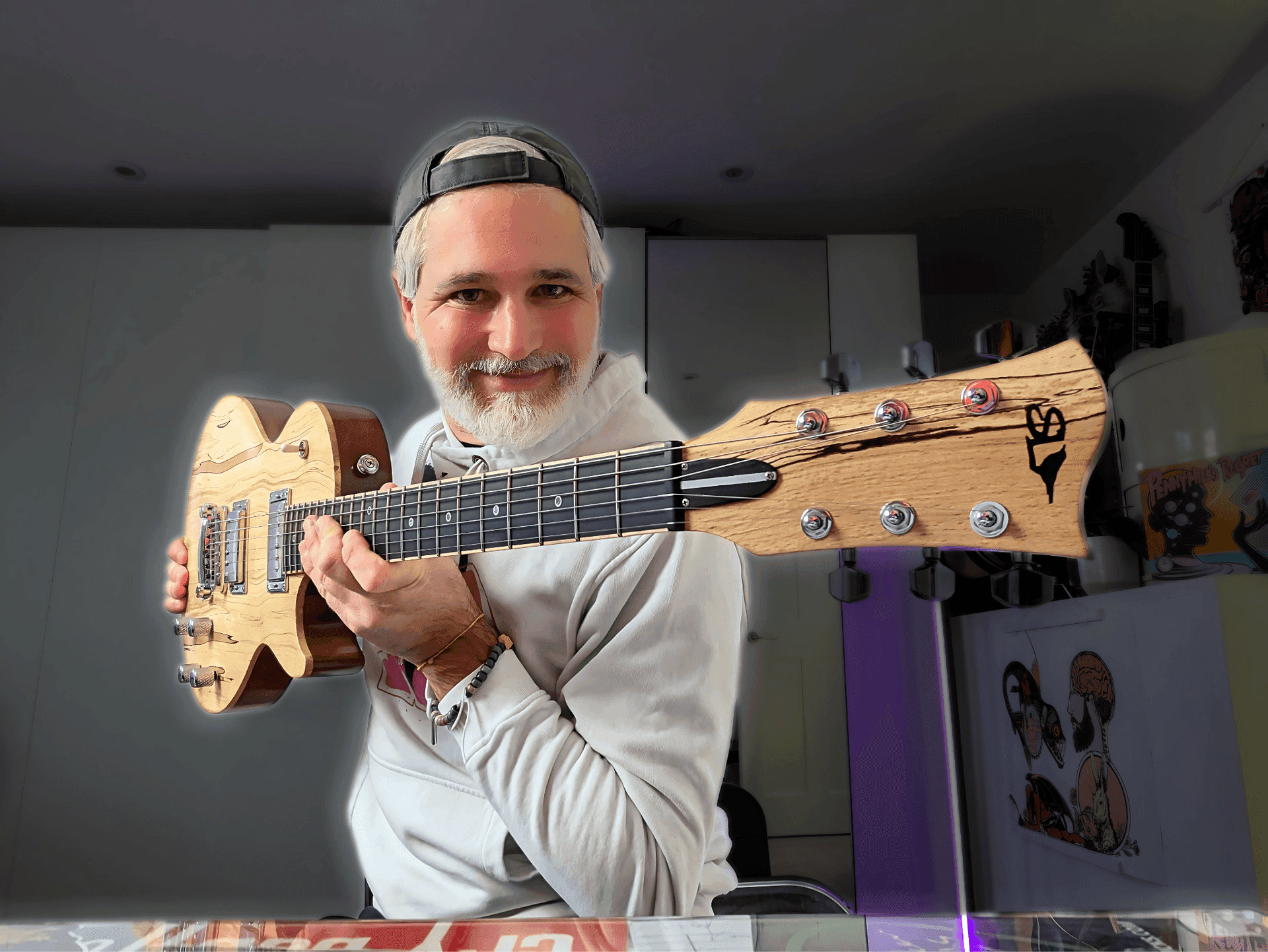 Person seated indoors playing a wooden electric guitar with a distinctive headstock design.